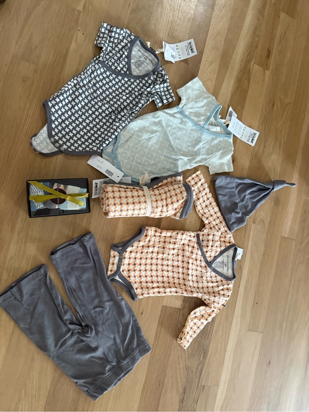 NWT Baby Clothes lot includes mix and match onesies, pant, hat, socks and blanke